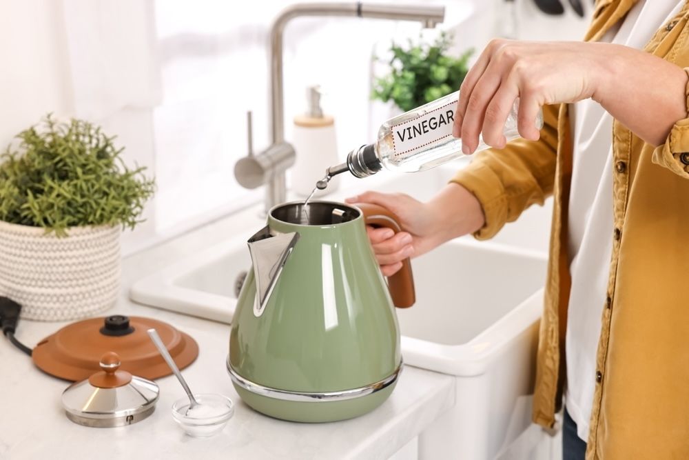 Descale your electric kettle with vinegar to keep it running smoothly. Regular descaling helps maintain optimal performance.