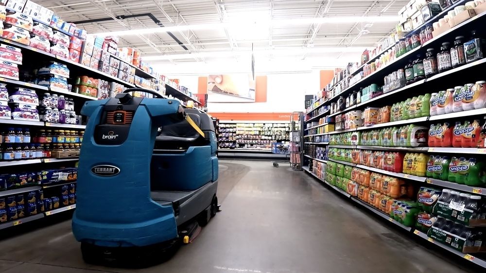 An automated floor scrubber in action, maintaining cleanliness in a busy commercial space.