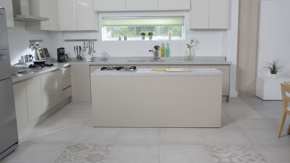 A kitchen with a tile floor.