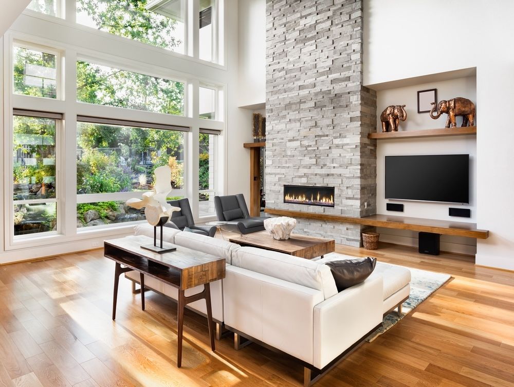 Large windows are key to maximizing natural light in your home. They provide expansive views of the outdoors, enhancing the connection to nature and creating a bright, welcoming atmosphere.