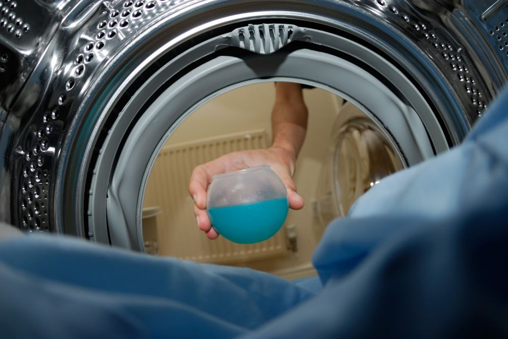 Use Liquid detergent in the washing machine.