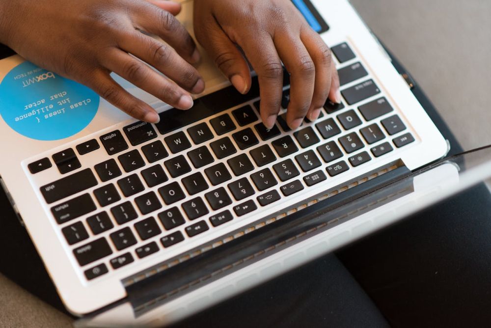 Typing on a keyboard while eating.