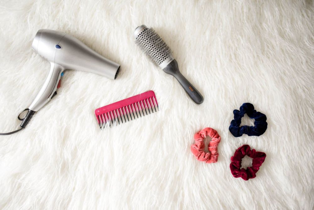 Hair dryer for cleaning the stained carpet.