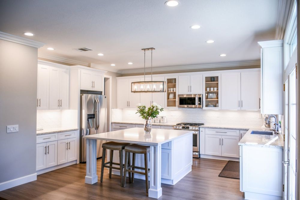 You can use clothes steamer to remove grease from the kitchen counters.