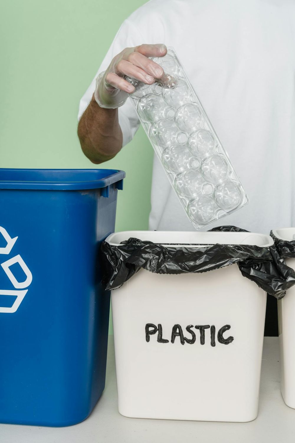 A box filled with plastic items for recycling.