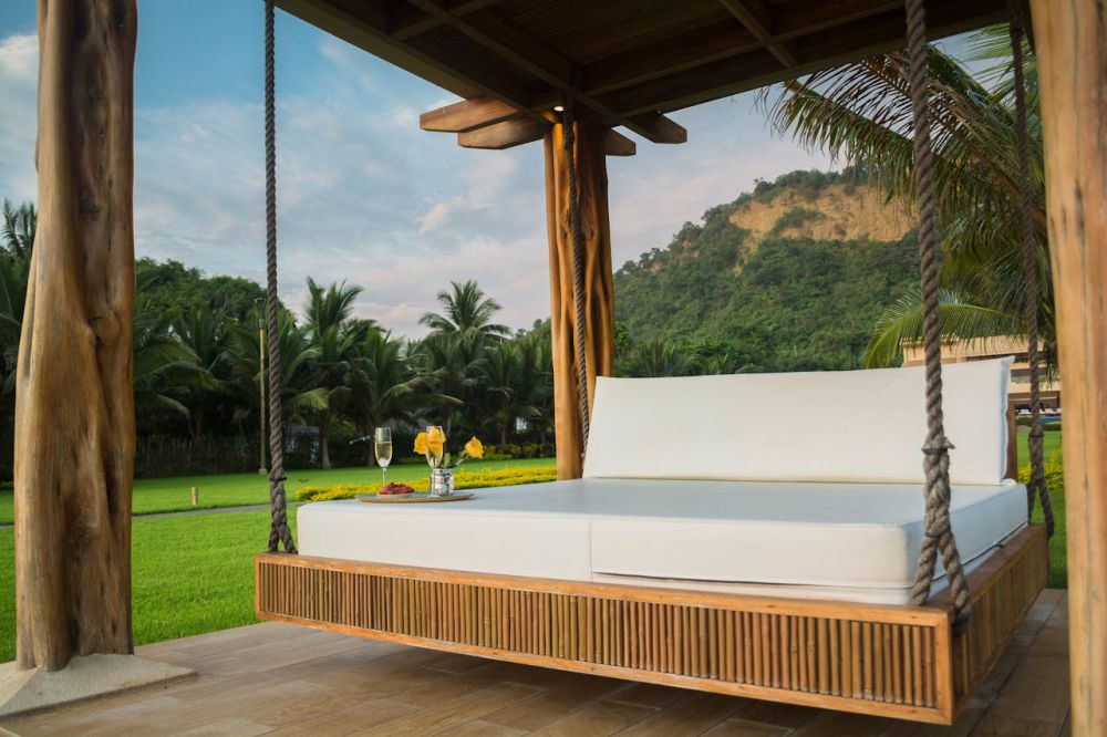 A mattress in a relaxed outdoor swing.