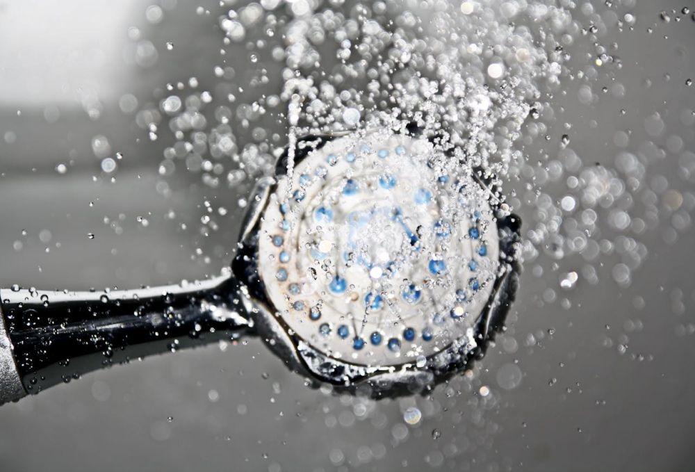 Clean water rolling down the shower.