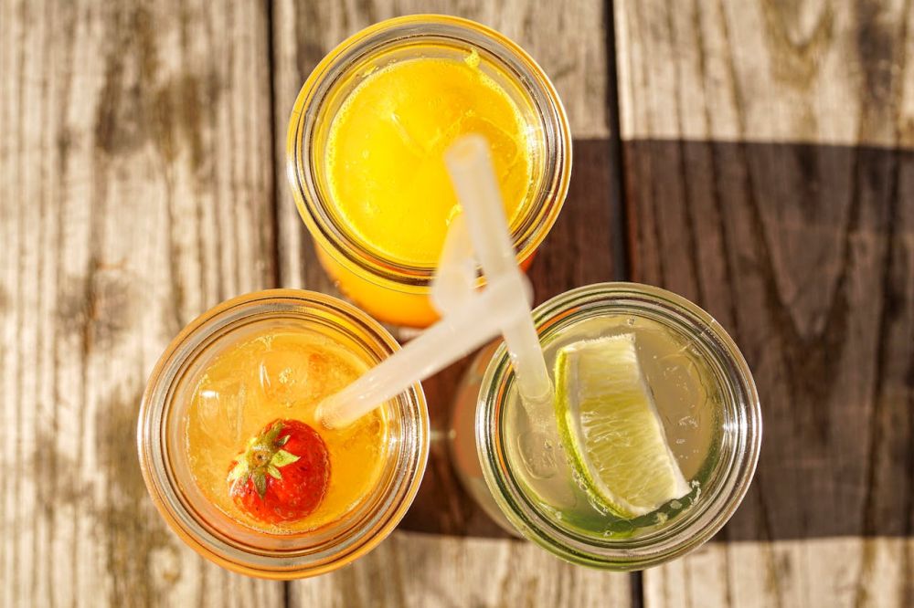 Cocktail with mint lime served in a mason jar.