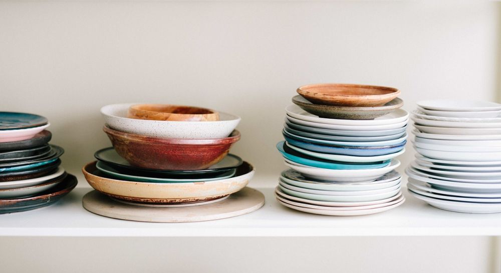 Wipe down all shelves after taking out the dishes.