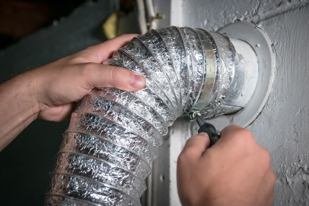 Reattach the vent hose to the dryer, ensuring a tight and secure connection.