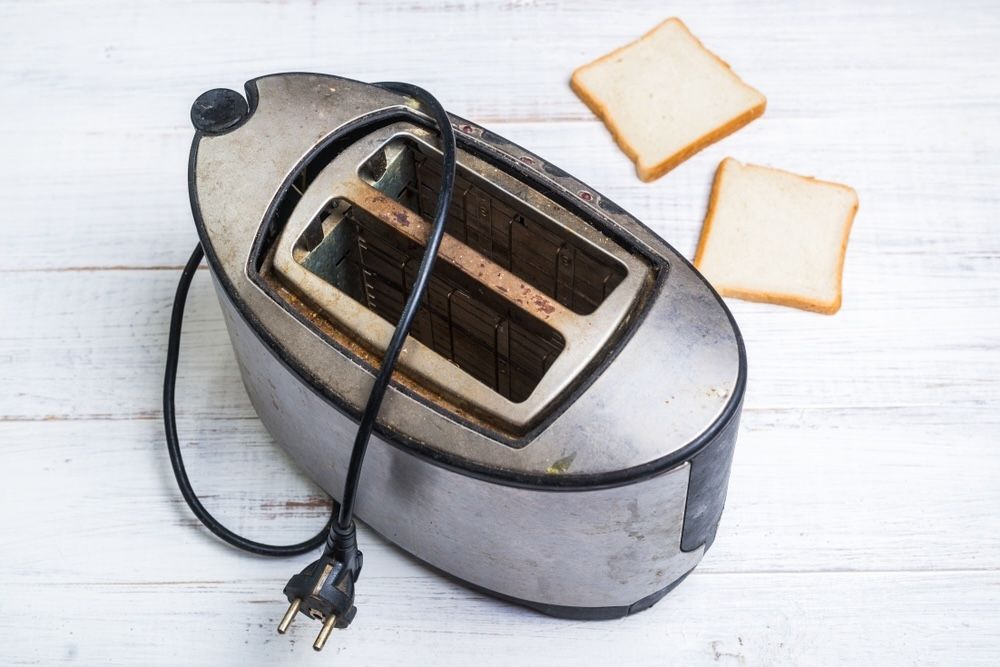 Unplugging your toaster and allowing it to cool down before cleaning is crucial for your safety and prevents electrical hazards.