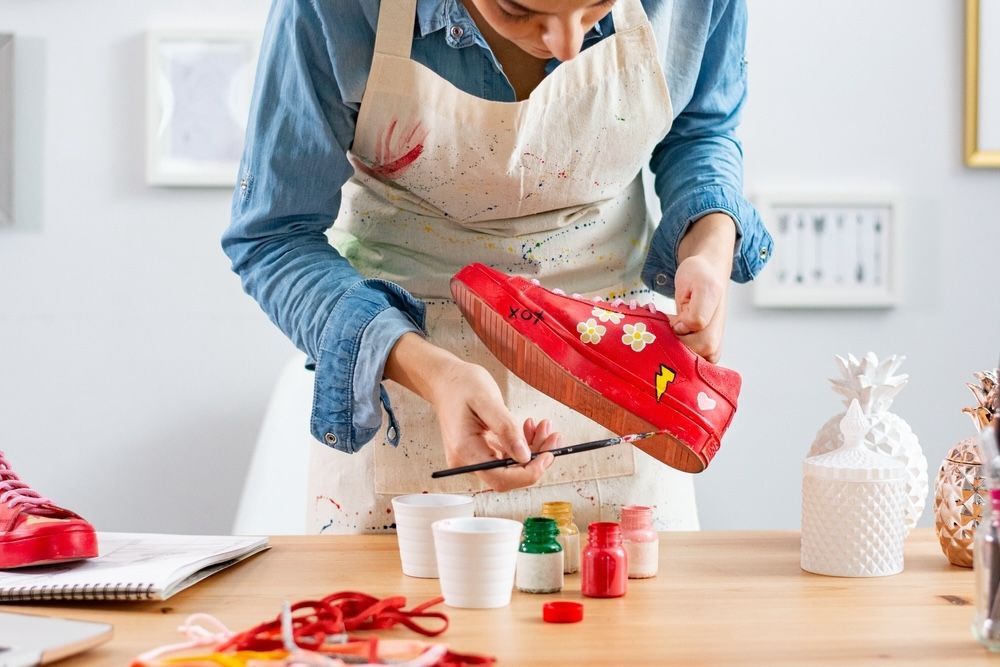 With a little paint, fabric, or other crafting materials, you can turn old shoes into personalized statement pieces for your home. This creative project transforms your worn-out shoes into decorative art, perfect for adding a unique, eco-friendly touch to any room.