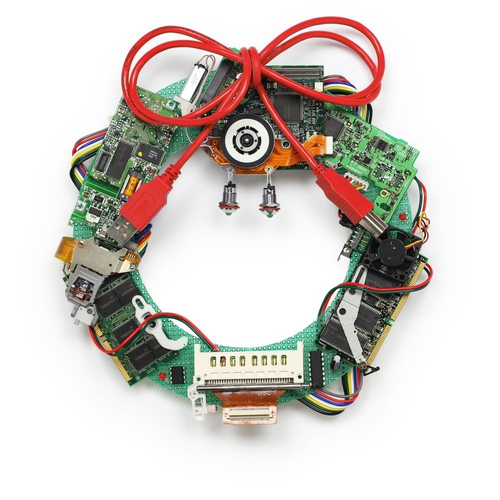 An artistic wreath made from repurposed electronic components, showcasing the creative potential of upcycling e-waste into unique decorative items.