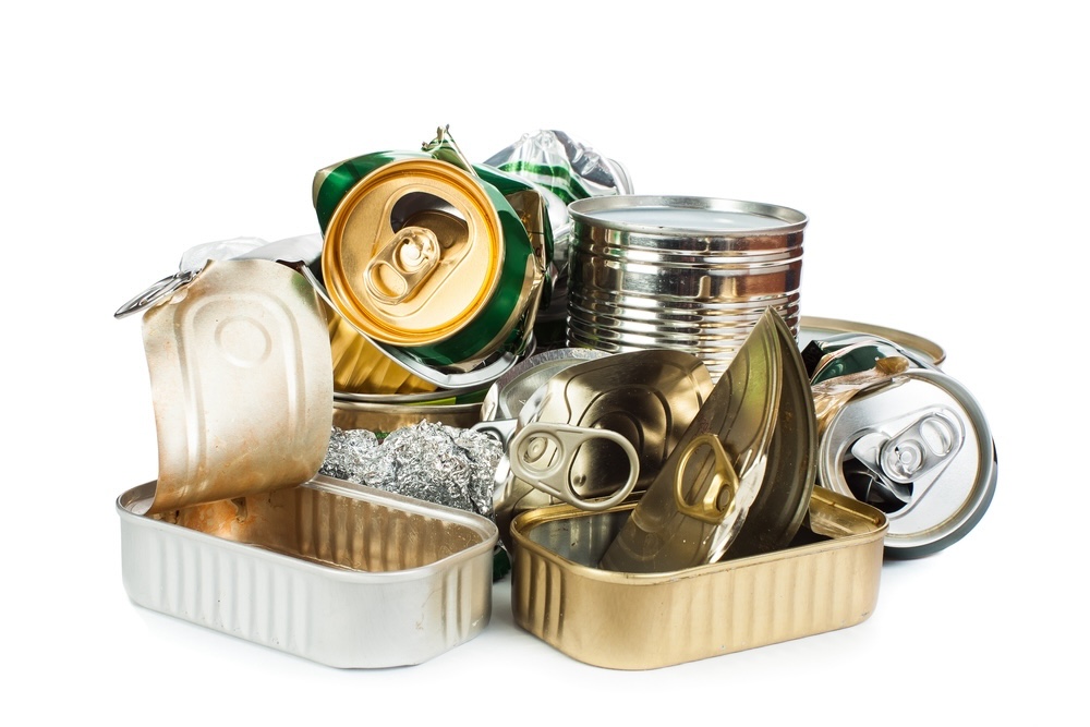 A collection of metal cans and tins, demonstrating the infinite recyclability of metals.