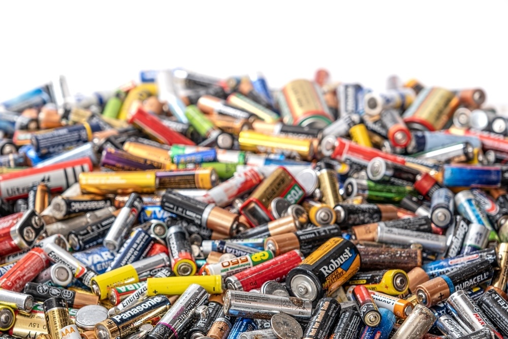A colorful collection of used batteries set for recycling.